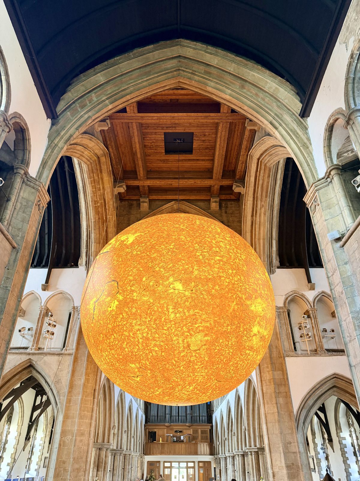 The Helios sun installation suspended inside Grimsby Minster.