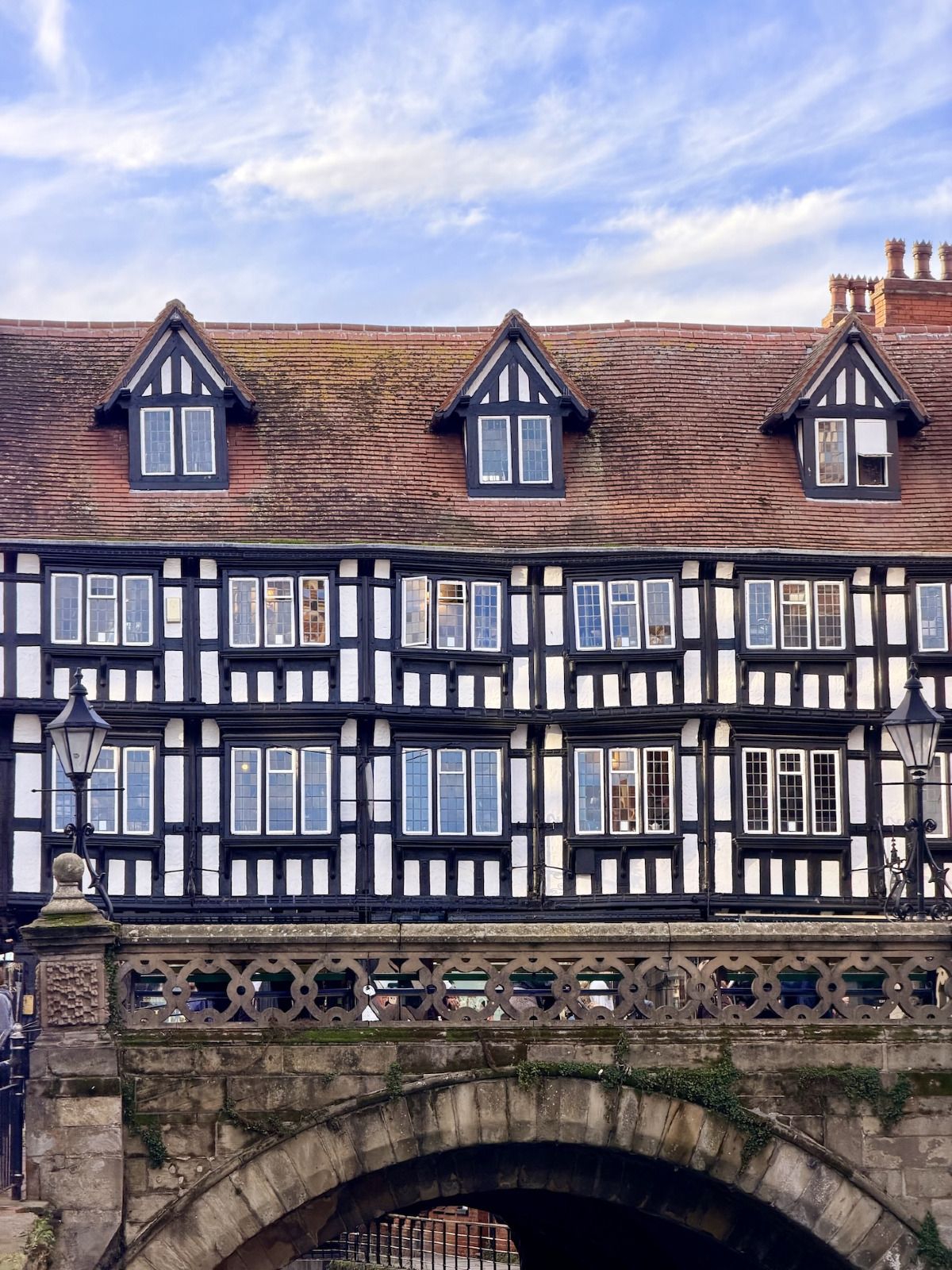 A black-and-white timbered building above Stonebow arch in Lincoln.
