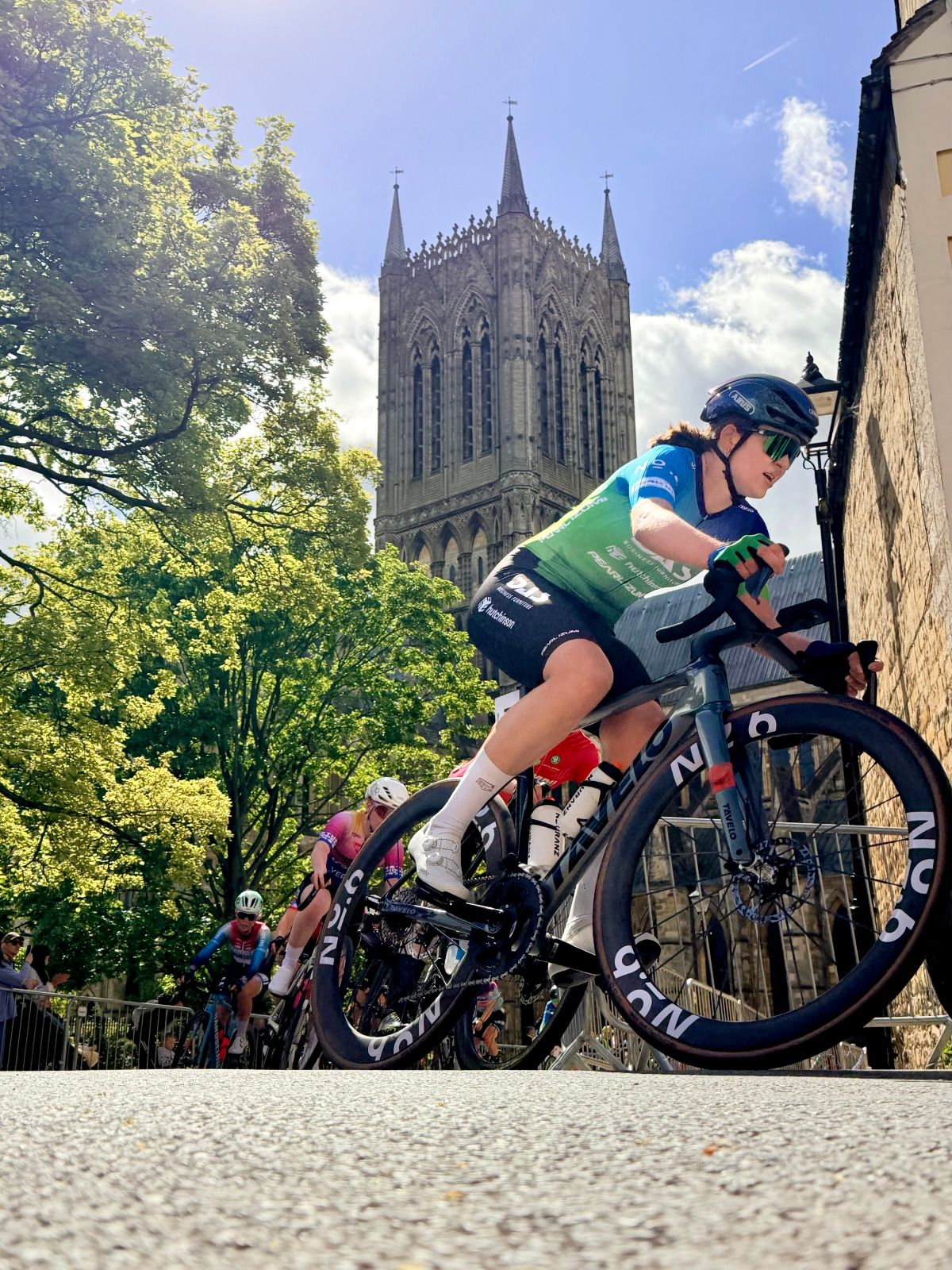 A cyclist climbs past Lincoln Cathedral during the Lincoln Grand Prix.